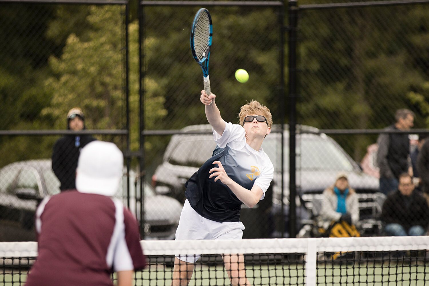 No. 3 doubles player, Garrett Meehan hits a hard shot back toward LaSalle opponents while battling in the Division 1 finals, Saturday.