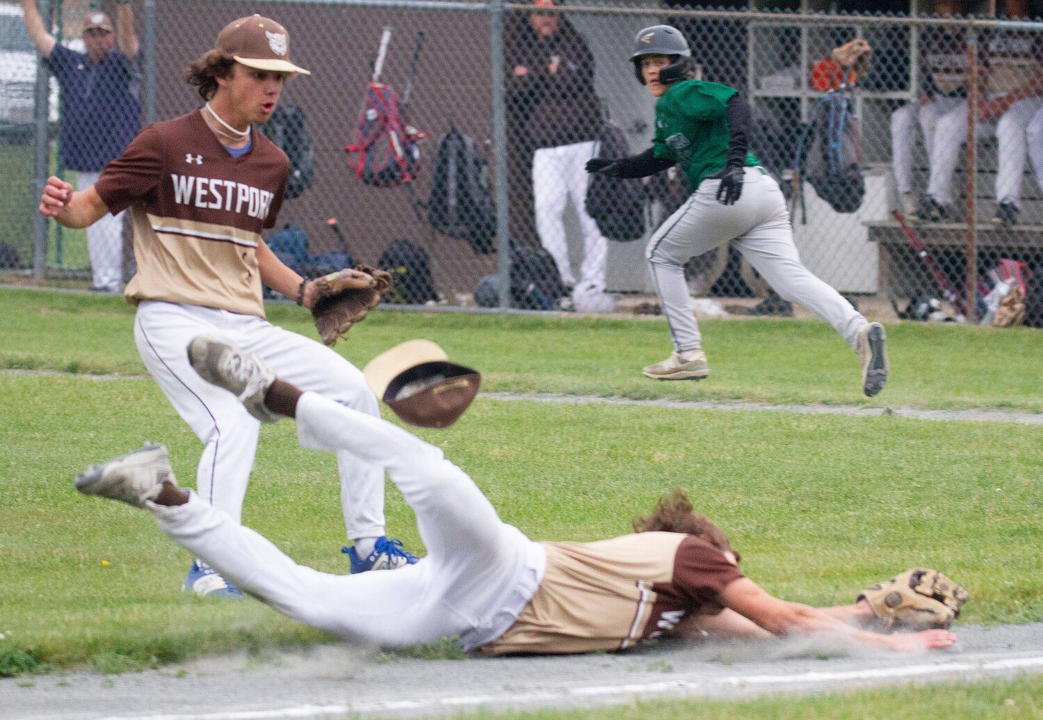 Third baseman Vaughn Costa dives for a bunted pop up, but didn't make the catch with pitcher Max Gallant (left).