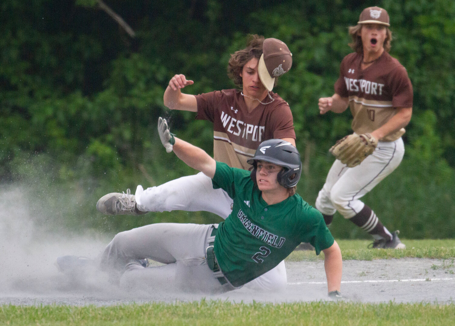Third baseman Vaughn Costa tags out Greenfield baserunner Mike Pierce to complete a 5-3-5 double play in the fourth inning during the Wildcats' 4-2 loss to Greenfield in the Round of 16 on Wednesday.
