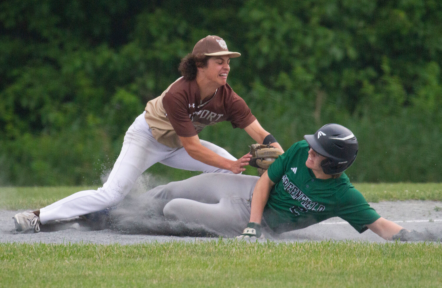 Third baseman Vaughn Costa tags out Greenfield baserunner Mike Pierce for a 5-3-5 double play in the fourth inning.