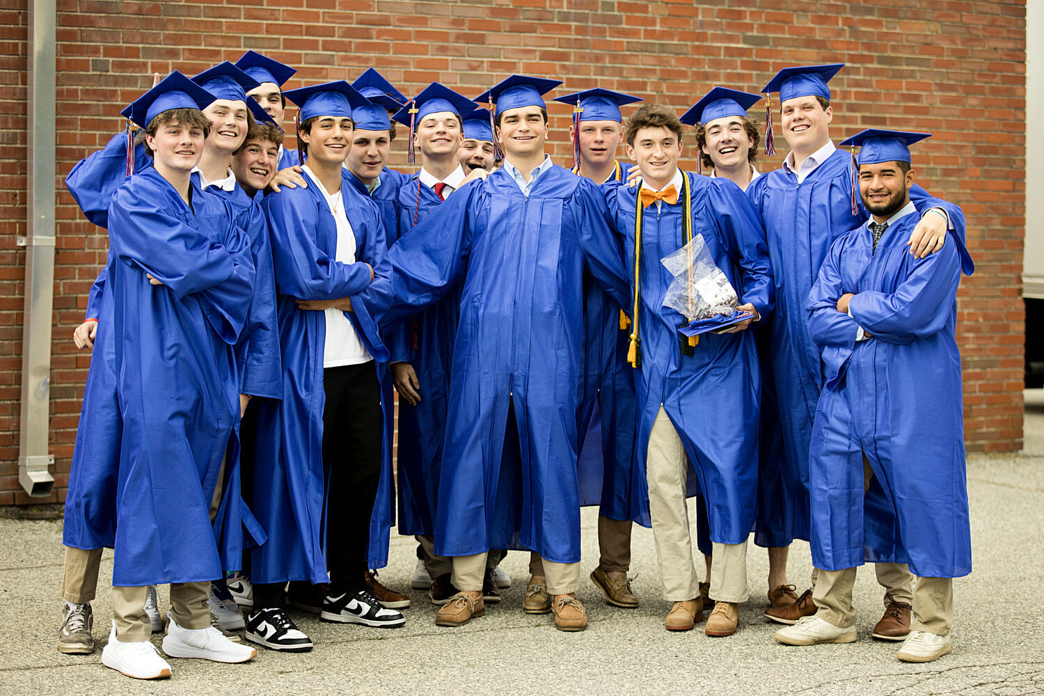 Portsmouth graduates gather outside the cafeteria before the ceremony, ,which was held in the PHS field house.