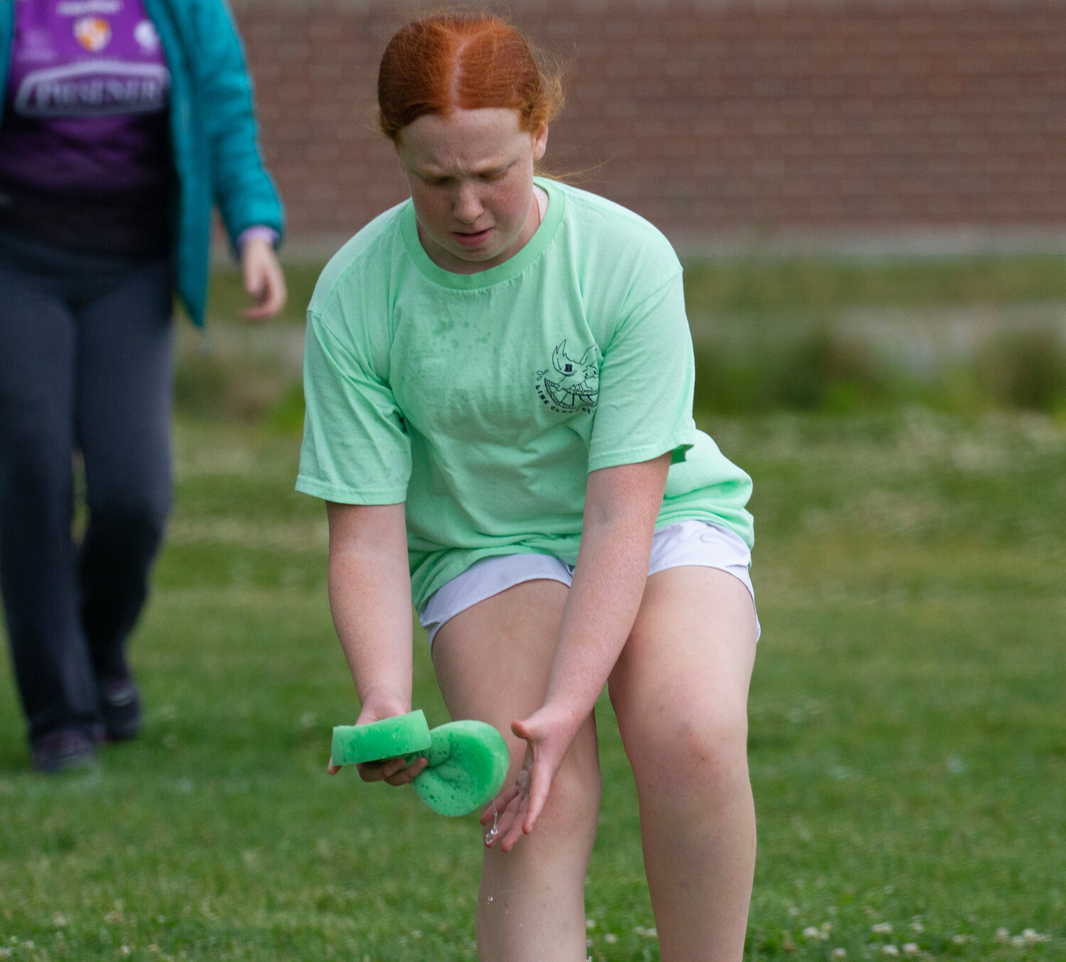 Claire Bickford competes in the sponge race during Lime Cluster's Field Day last week.