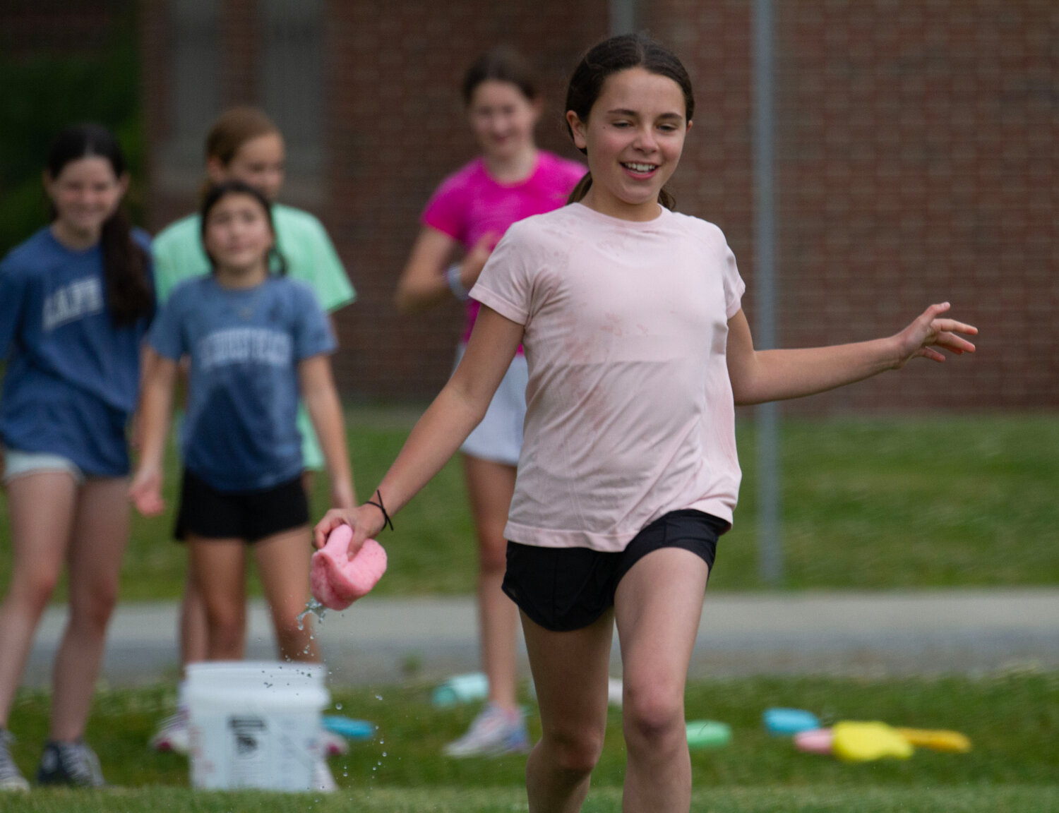 Finley Mattos competes in the sponge race during Lime Cluster's Field Day event last week.