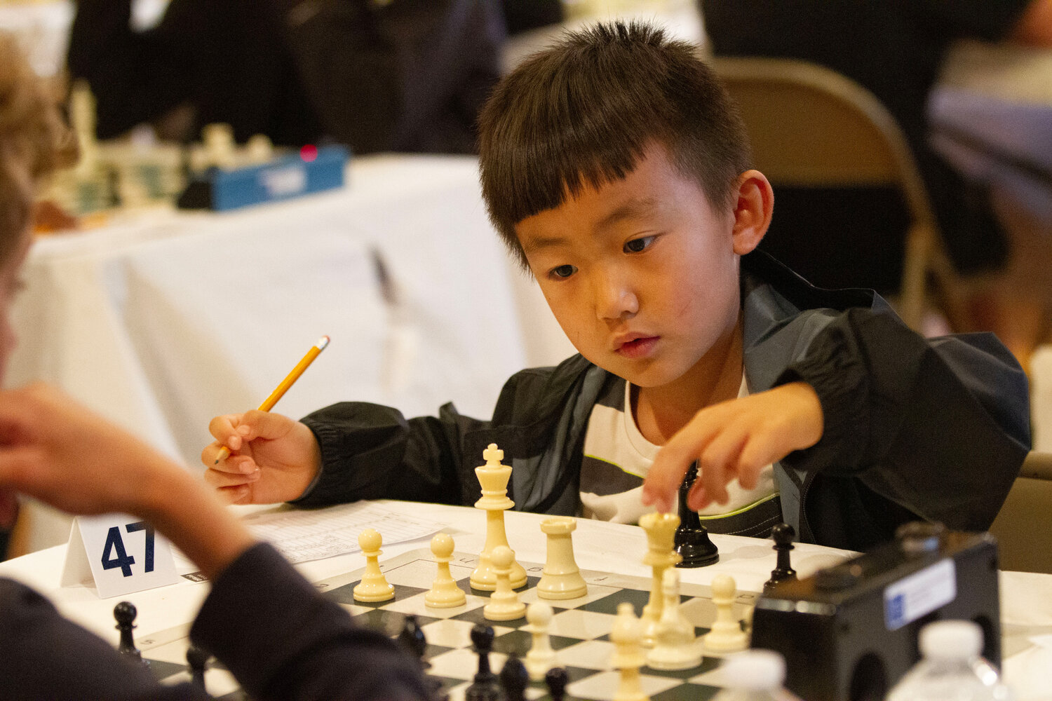 Sycamore Yuan makes a move during his fourth round match.