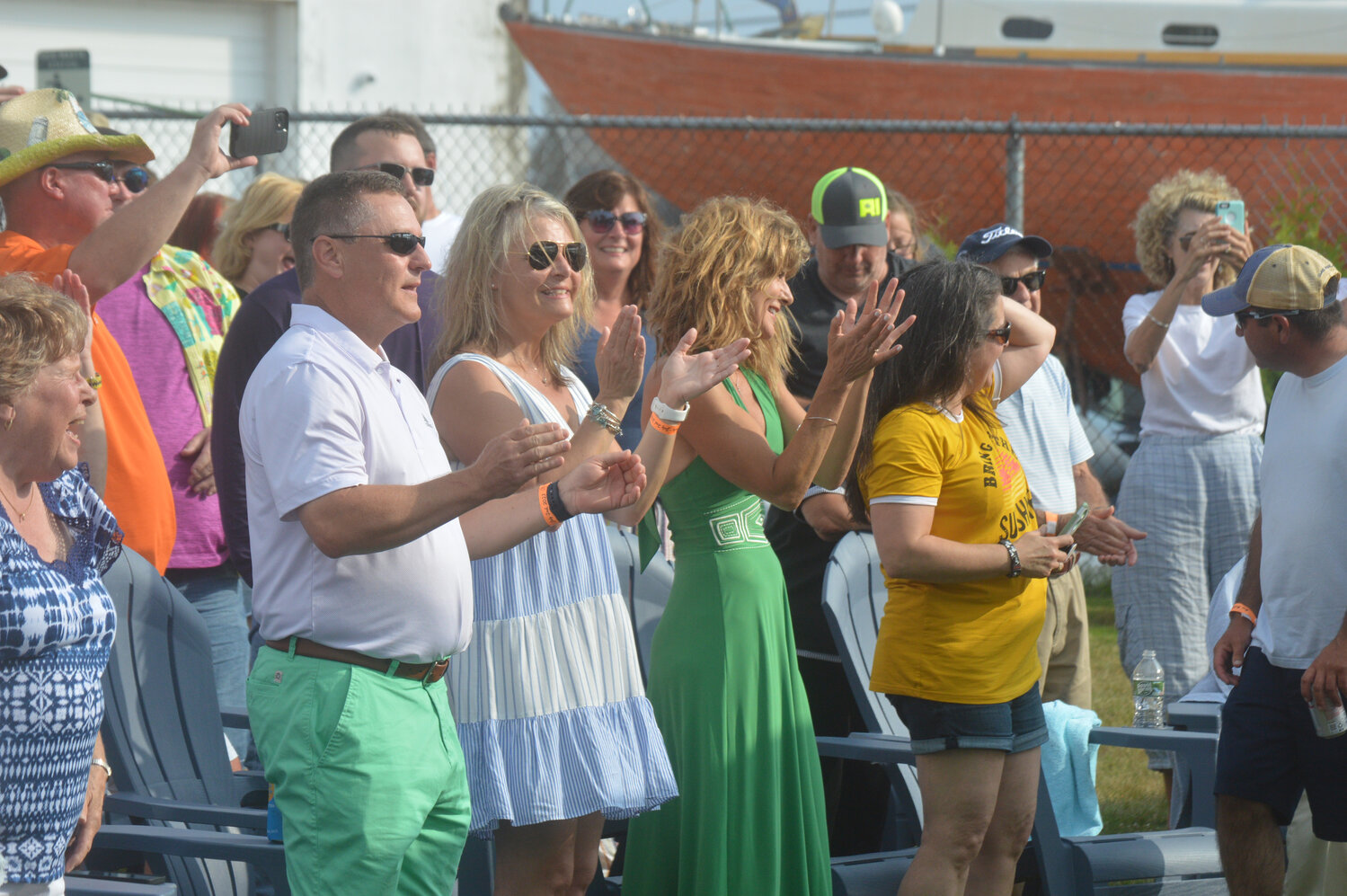 Members of the crowd groove to the sounds of “Margaritaville” and other Buffett hits.