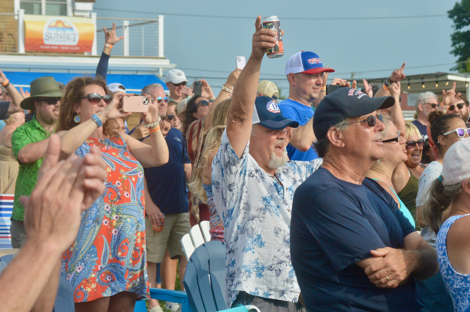 Members of the crowd groove to the sounds of “Margaritaville” and other Buffett hits.