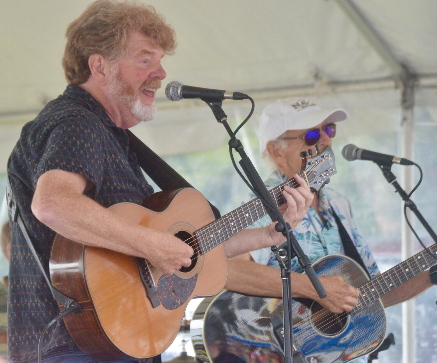 Mac McAnally (left) and Jimmy Buffett thrilled the crowd with some familiar hits.