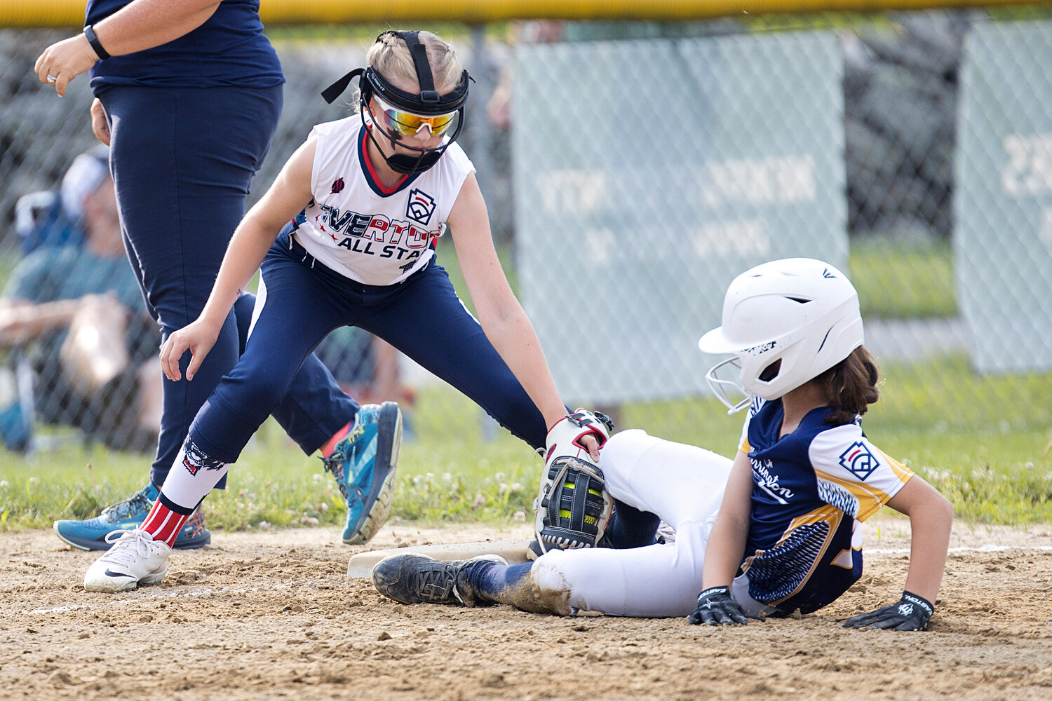 Kylie Hill attempts to tag a Barrington runner out at third. 