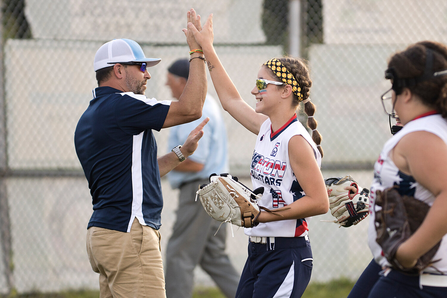 Emma Helger is high-fived after leaving the bases loaded in the third inning.