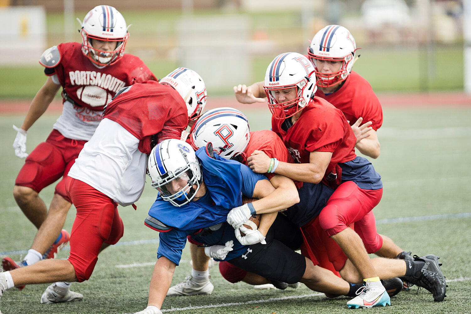 The Patriots defense stops a Middletown ball-carrier from advancing.