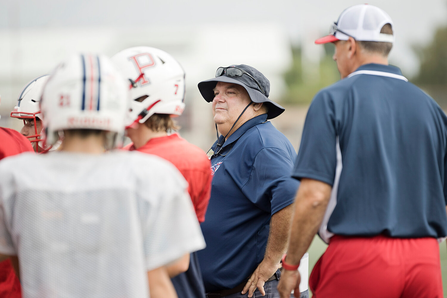 The Patriots’ new head coach, Keith MacDonald, watches over his players.