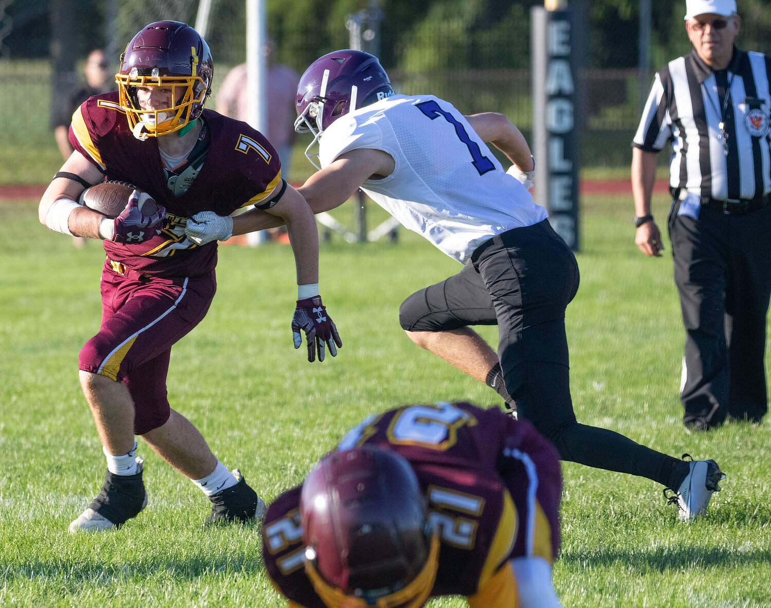 Running back Aiden Champ runs by a Huskies defender during an outside run during the Tigers' loss to Mt. Hope in the annual injury fund game in Barrington on Thursday.