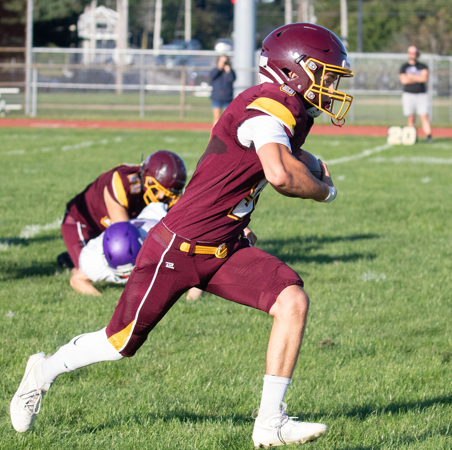 Quarterback Ben Troia runs for a Tigers' first down on a keeper.