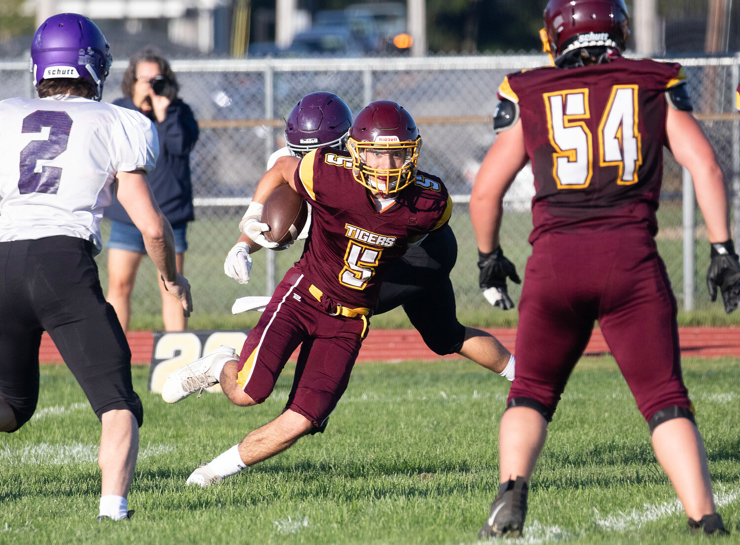 Junior wide receiver Roman Fauci looks to run upfield after making a catch.