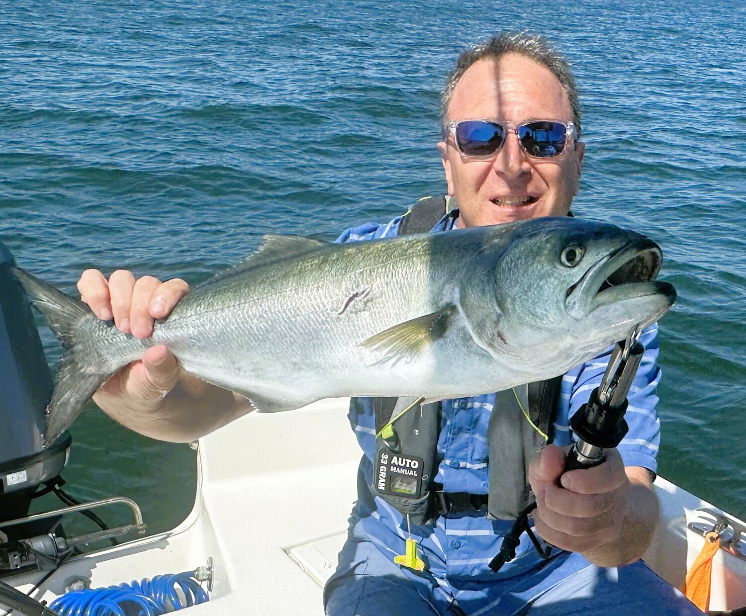Steve Brustein with a bluefish caught on a Yo-Zuri Crystal Minnow swimming lure off Hope Island on Sunday.
