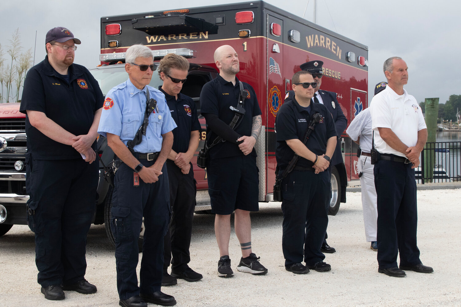 Warren Fire Department and EMS personnel, along with Chief Sousa, stoically take in the remembrance event.