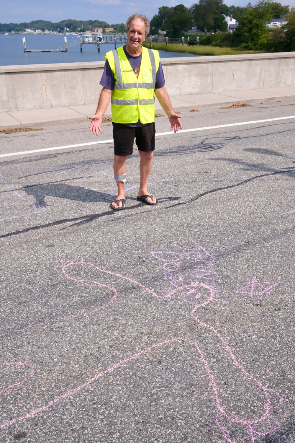 John Vitkevich, one of the local event organizers, stands next to the outline some children drew around him on Park Avenue, where he was volunteering as a guide. “I’m John Doe,” he joked.