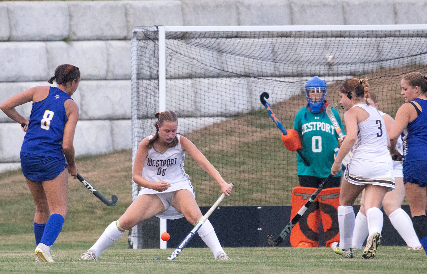 Colleen Smith (left) makes a save ahead of goalkeeper Hannah Abrams (right).