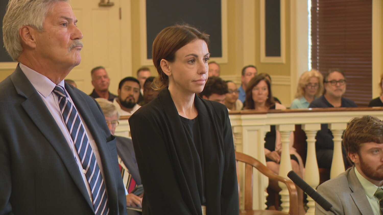 Barrington resident Rachel Onik (right) is shown during her arraignment on Sept. 13. Newport Police levied two new felony charges against Onik recently.