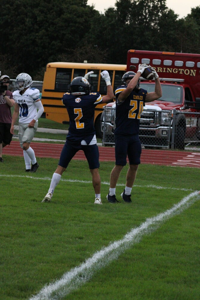 AJ DiOrio (right) and Spencer Proulx (left) celebrate DiOrio's first touchdown against Shea.