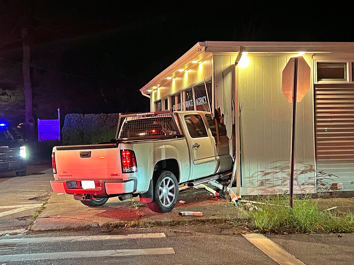 Barrington Police charged a Warwick man with DUI after he drove his pickup truck into an office building on Saturday night.
