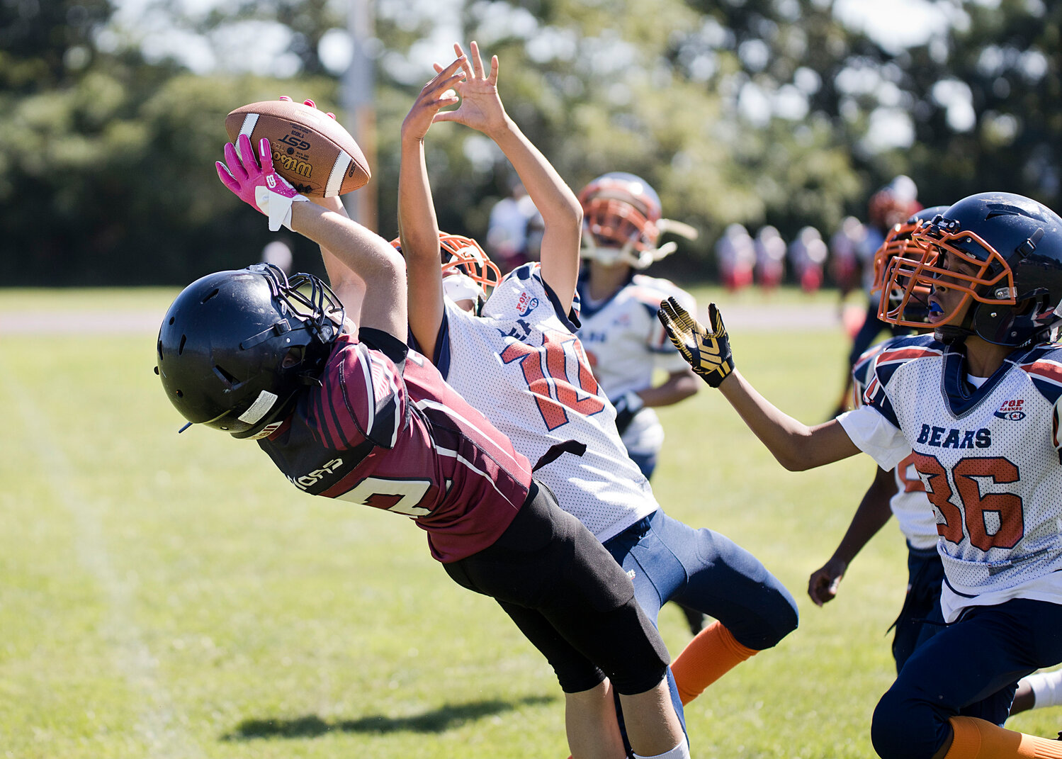 Jay DaPonte catches a touchdown pass during 10U's battle with New Bedford, Sunday. 