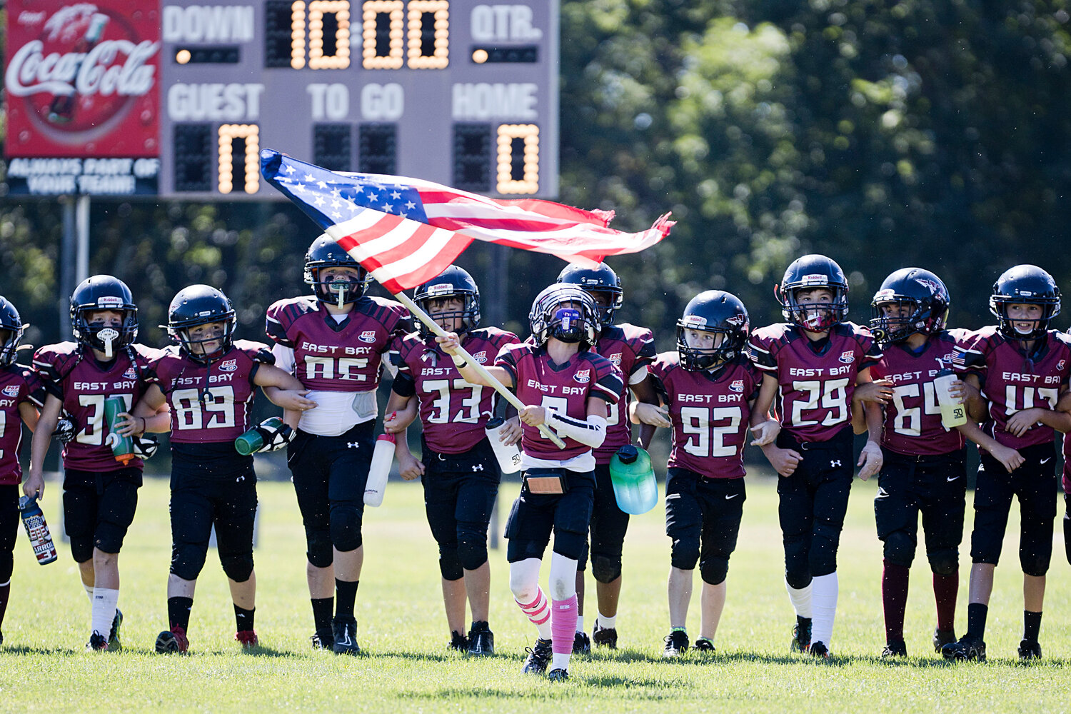 The 10U team takes the field before their home opener match against New Bedford. 