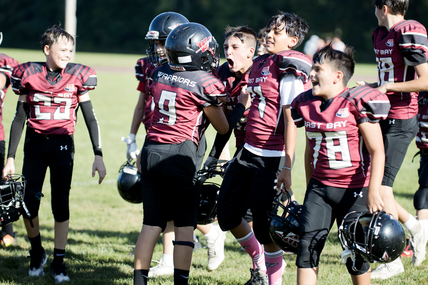 12U celebrates their first win of the season after beating Portsmouth White 38-13, Sunday. 