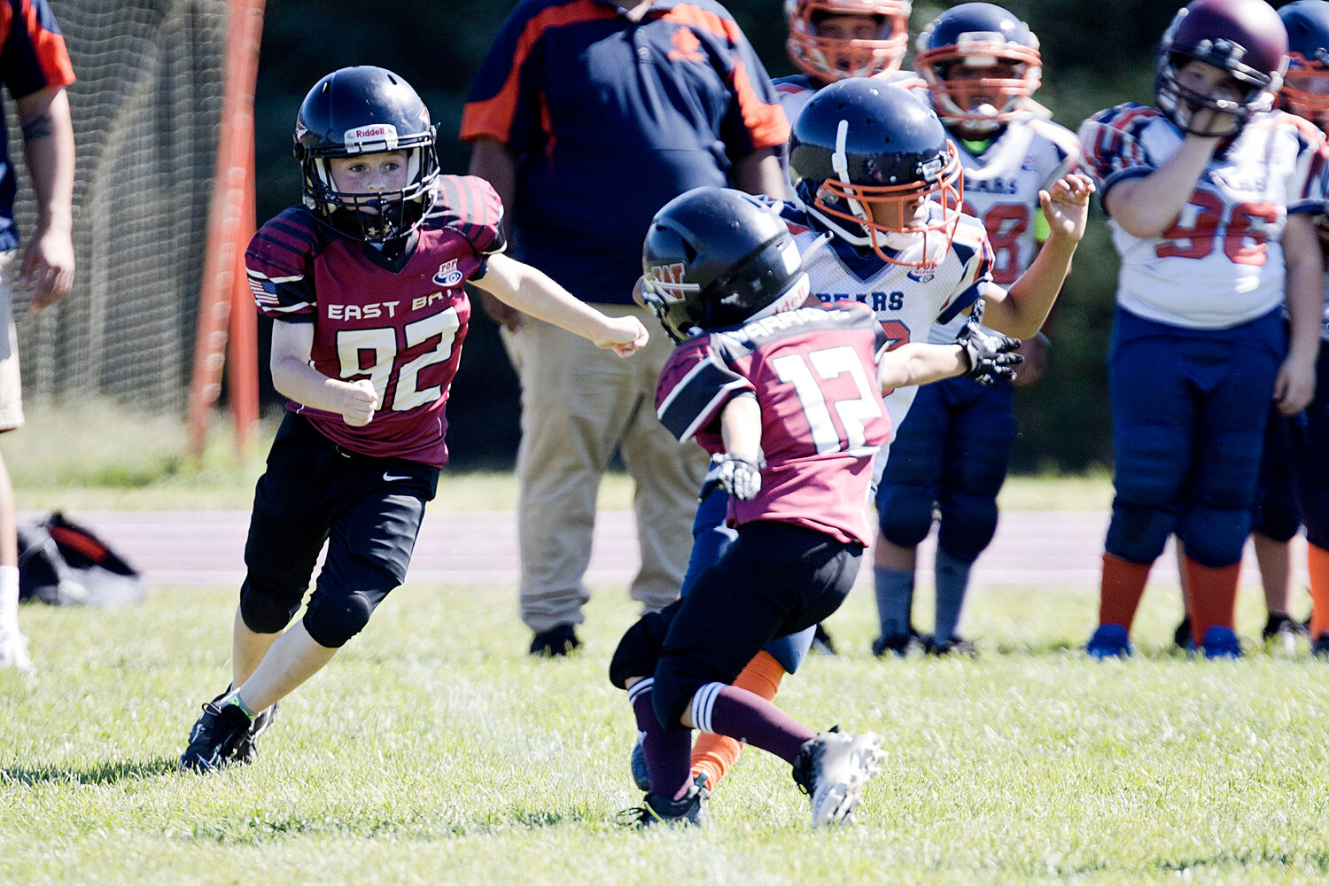 10U's Drew Oliver (left) and Camden Sylvia pursue a New Bedford running back. 