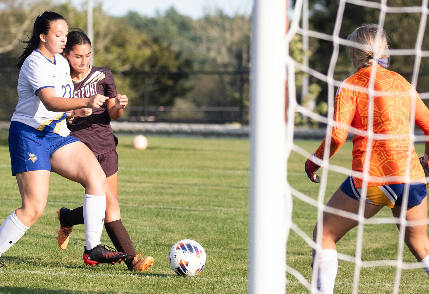 Freshman forward Morgan Pacheco attempts to take a kick on goal, while covered by a defender.