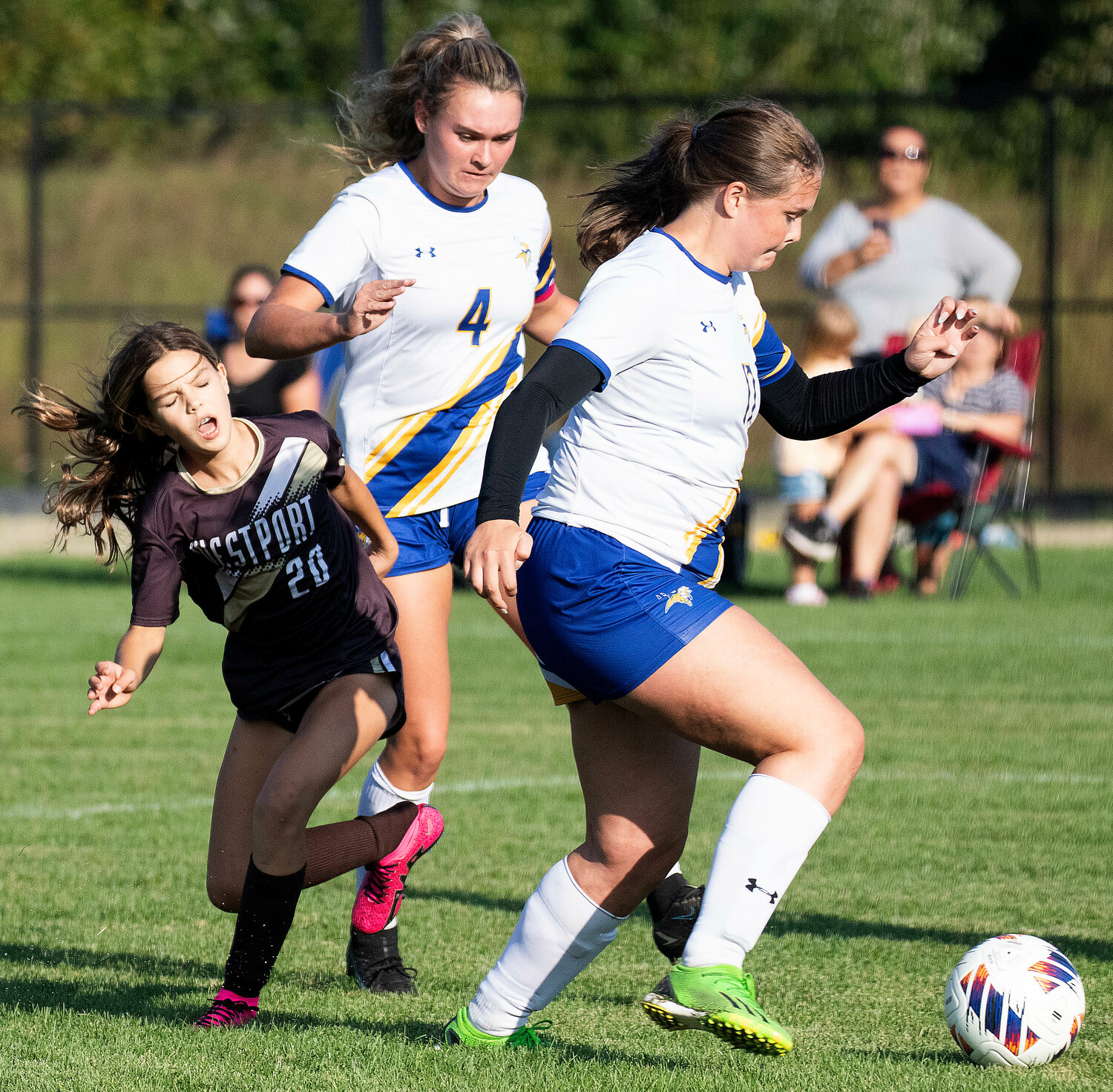 Forward Lily Veracka gets crunched by a pair of Wareham defenders. The seventh grader scored 2 goals against Wareham and leads the team with 4 goals for the season.