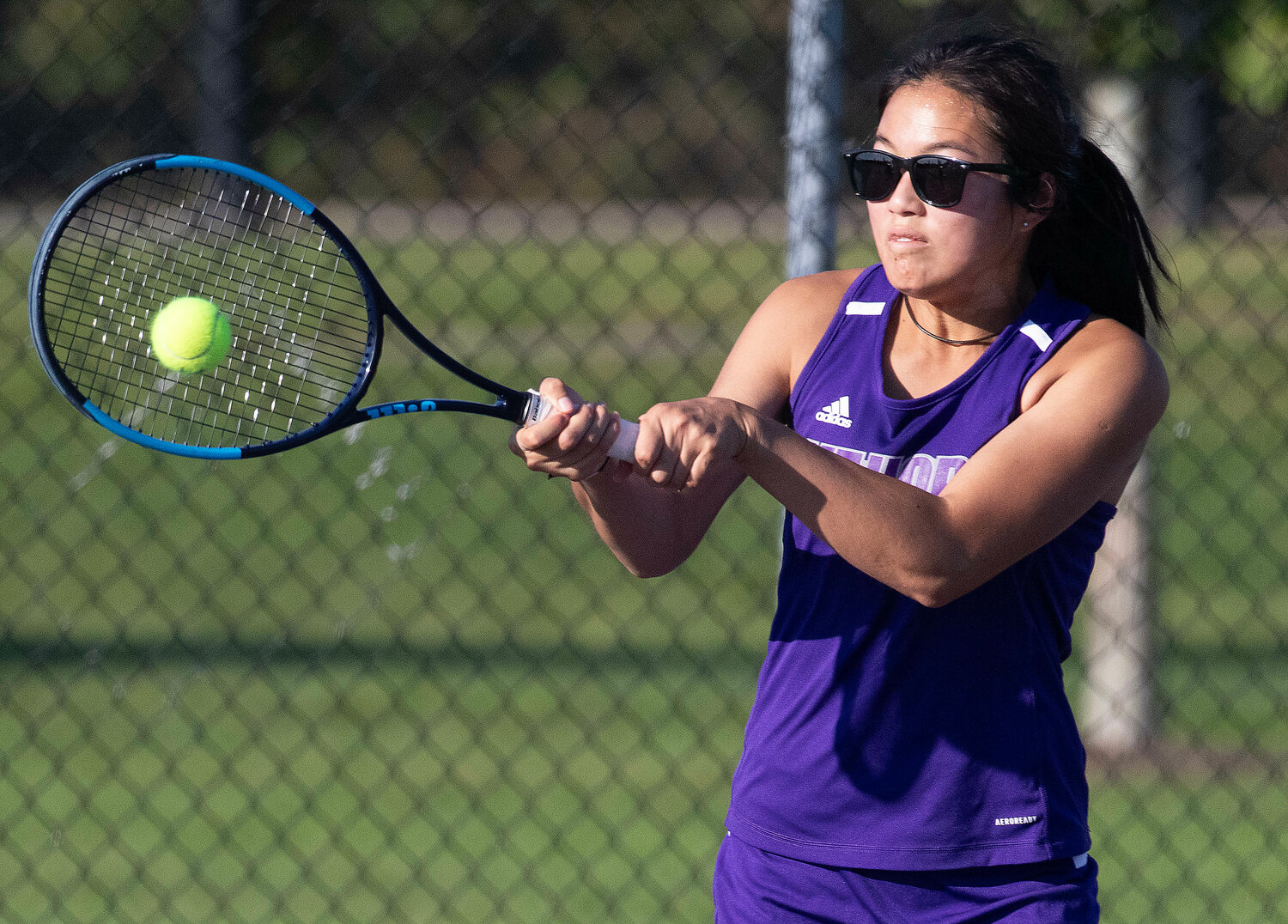 Huskies first singles player Elsa White hits a backhand during her 6-3, 6-4, win over Mia Renzulli of Prout. White has been dominant at times in her 4-1 start to the season.