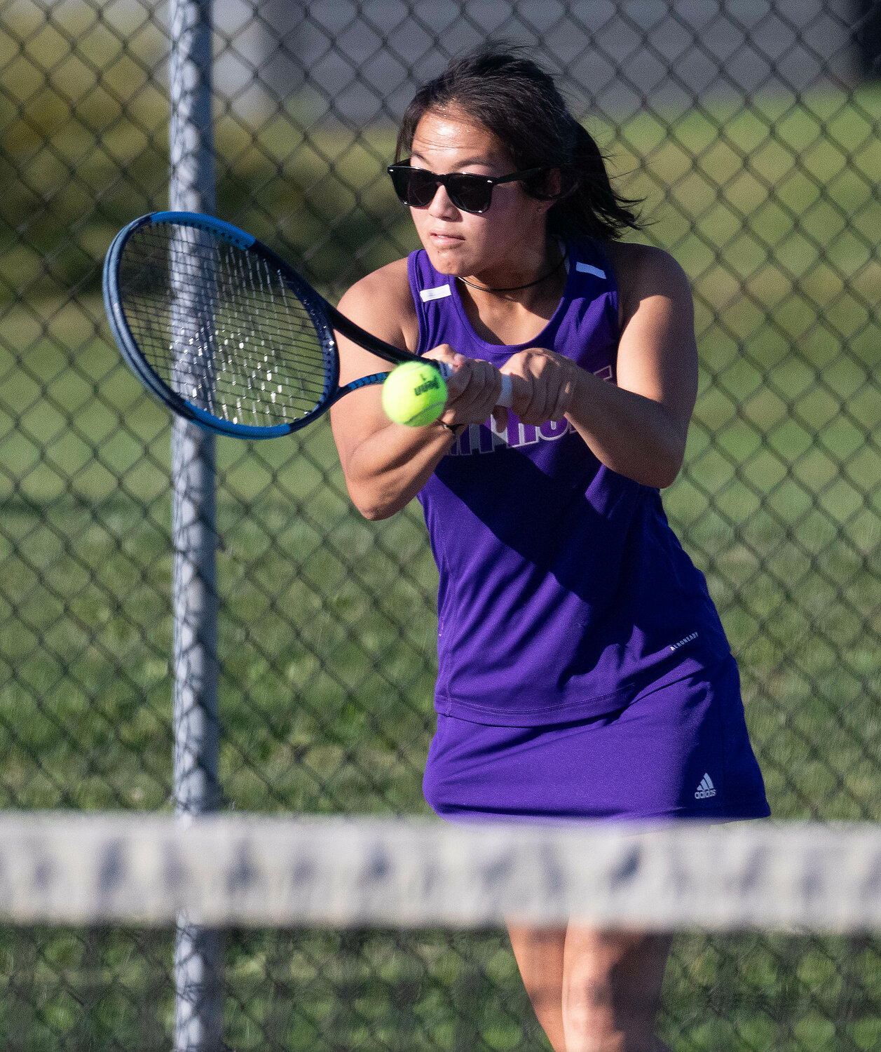 Huskies first singles player Elsa White hits a backhand during her 6-3, 6-4, win over Mia Renzulli of Prout. White has been dominant at times in her 4-1 start to the season.