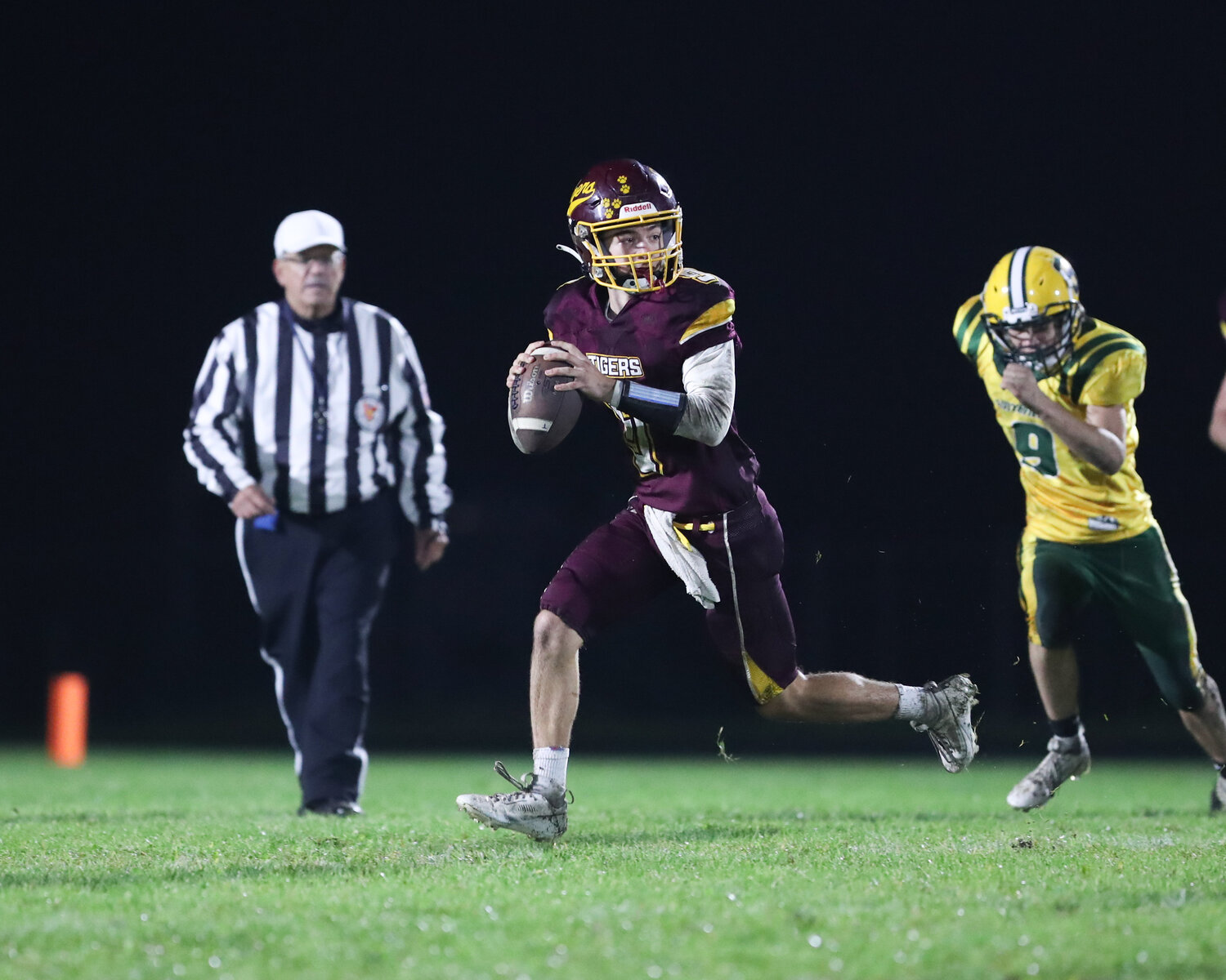 Quarterback Ben Troia looks to pass as he is forced outside the pocket.