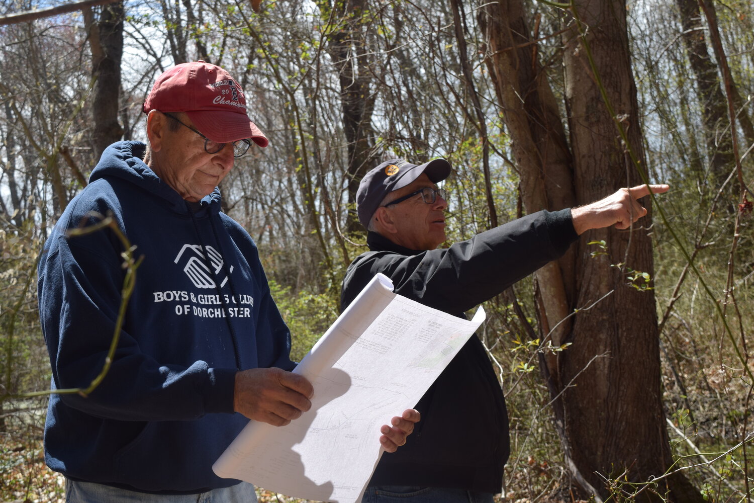 Joe D’Arrigo, husband of Mary (Dziedzic) D’Arrigo, (left) examines property maps with Victor Lerish, chairman of stewardship for the Barrington Land Conservation Trust.