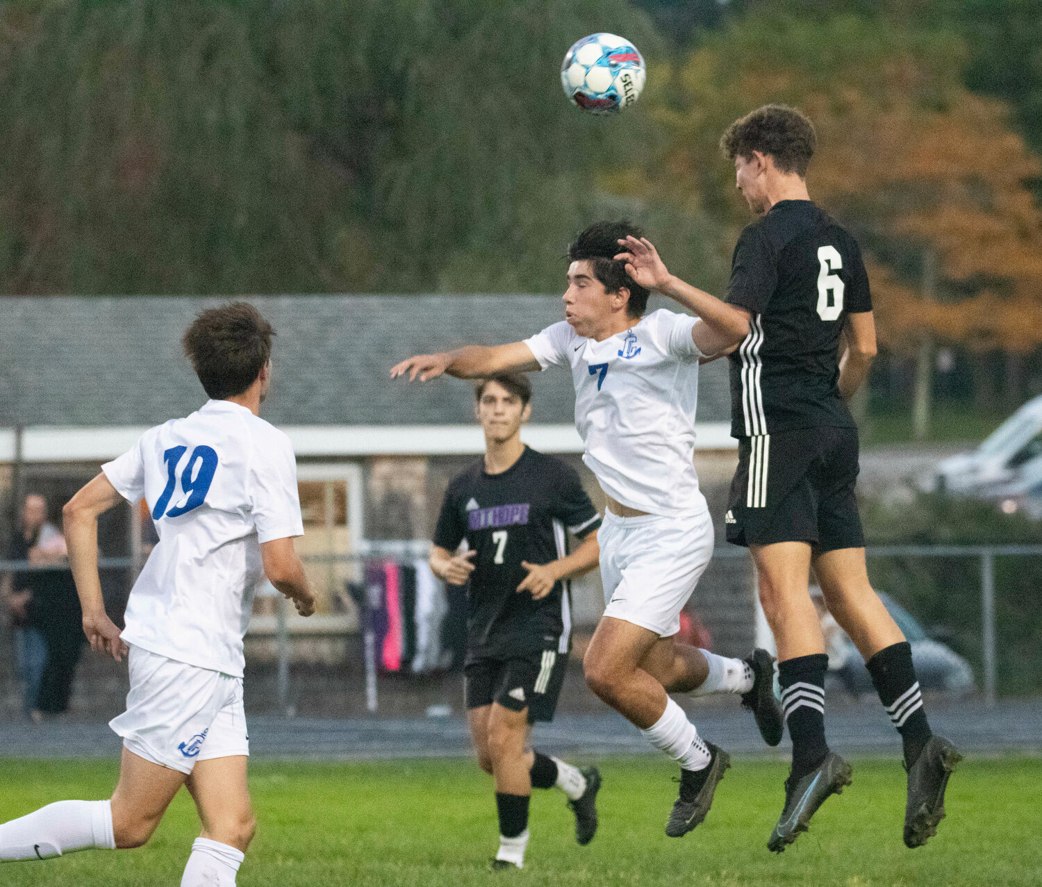Center back Aidan Pereira puts his head on a Cumberland cross with teammate Jesse Wilson looking on.