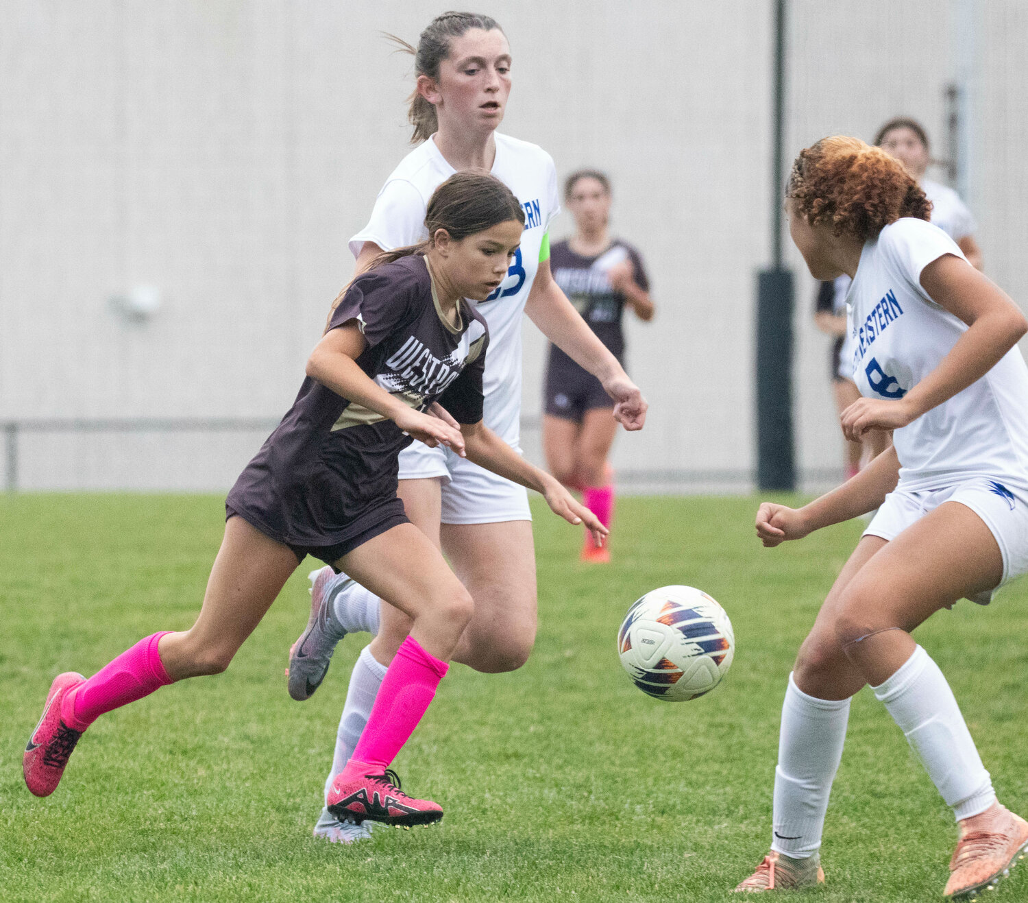 Lily Veracka dribbles through a pair defenders before scoring a goal to give Westport a 1-0 lead in the second half of the Wildcats' win over Southeastern on Wednesday.