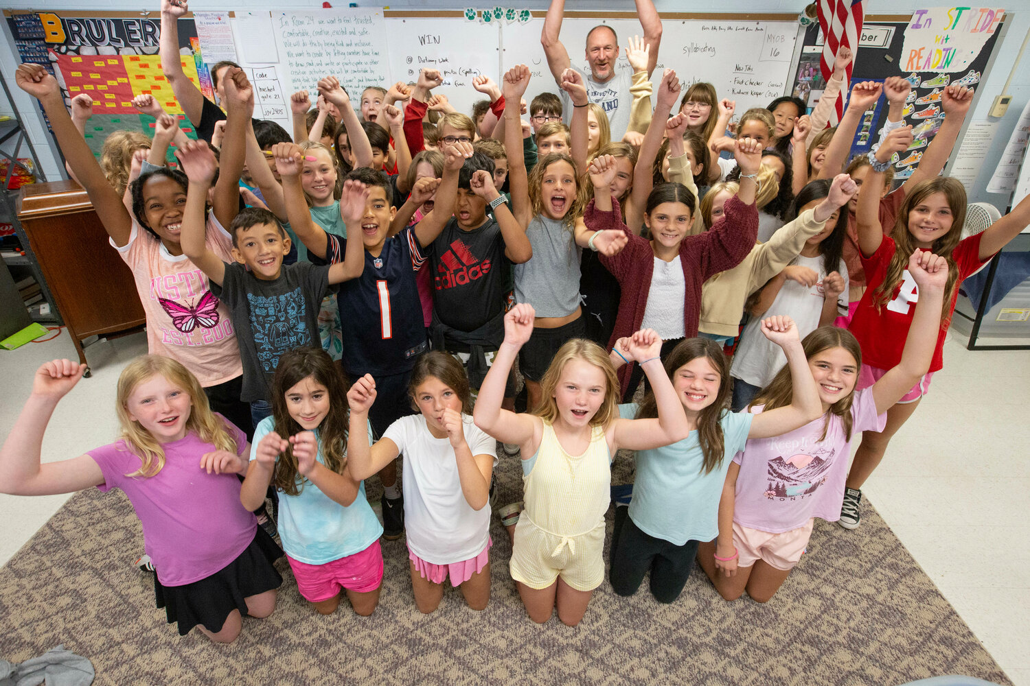 Students in Mark Whittaker’s and Kristin Mitchell’s classes at Hampden Meadows School celebrate after hearing that they will be reporters for the Barrington Times Kids Corner page.