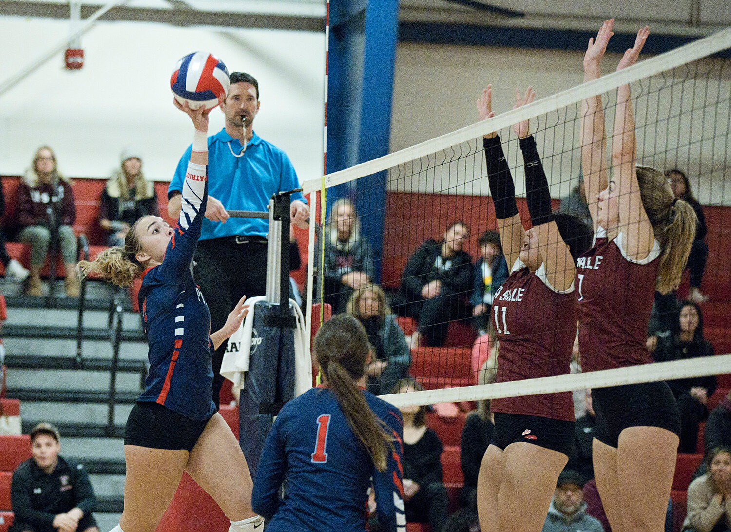 Danielle Bannister spikes the ball over the net while rallying with La Salle.