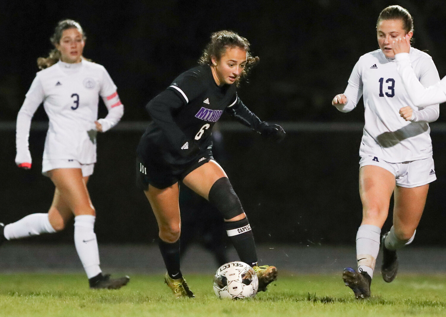 Caitlyn Terceiro dribbles up field during the Huskies' win over South Kingstown in the quarterfinals on Friday.