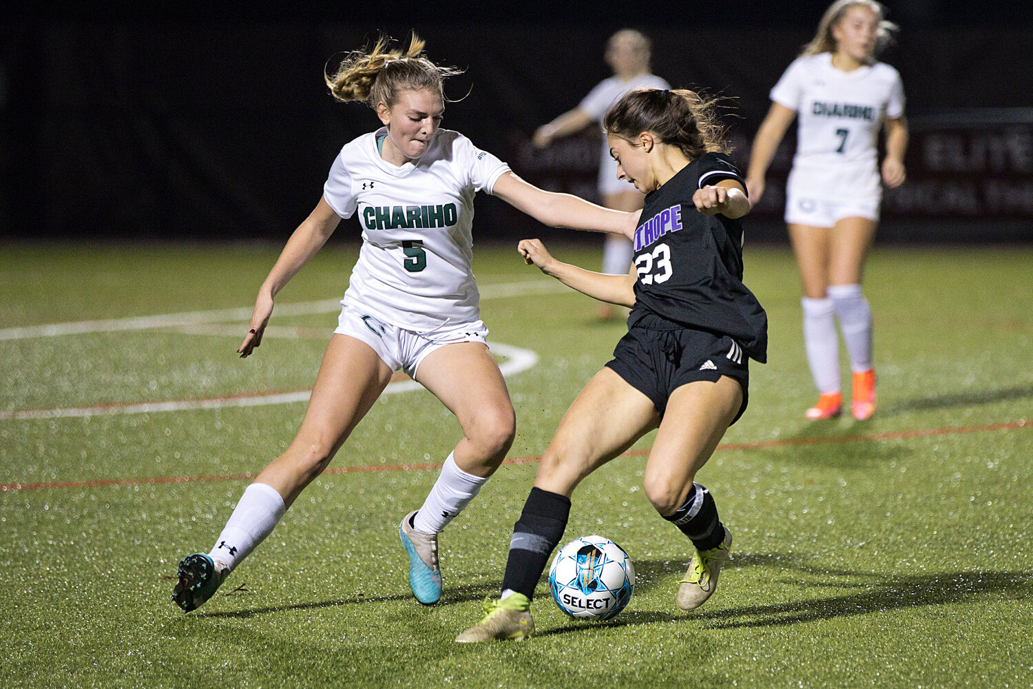 Hannah Rezendes maneuvers the ball away from a Chariho opponent.