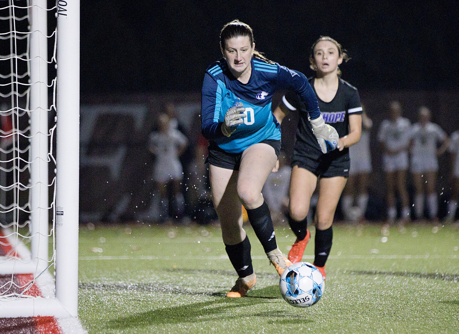 Goalkeeper Emily Moran races to stop a penalty shot in the final seconds of Tuesday's semifinal match against Chariho.