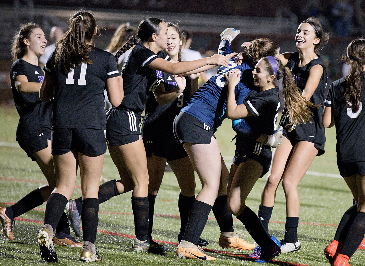 The Huskies celebrate a 1-0 win against Chariho in the Division I semifinals, Tuesday. They will play Cumberland in the state championship at Rhode Island College on Saturday.