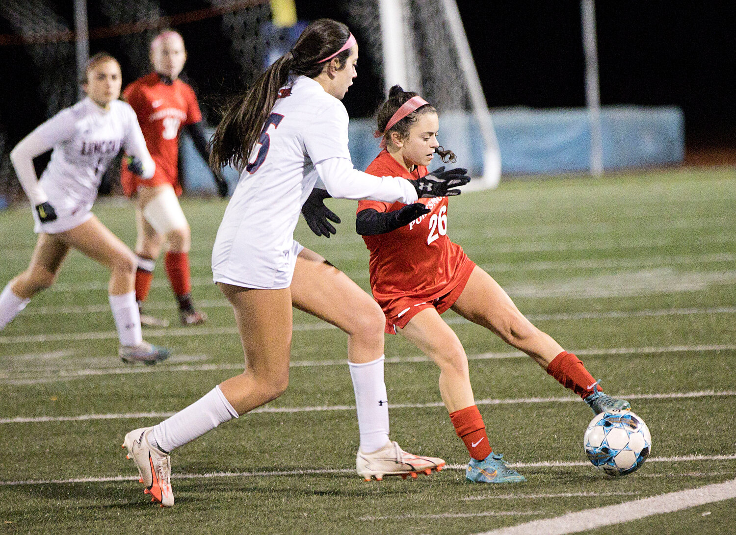 Abby Costa maneuvers the ball away from a Lincoln opponent.