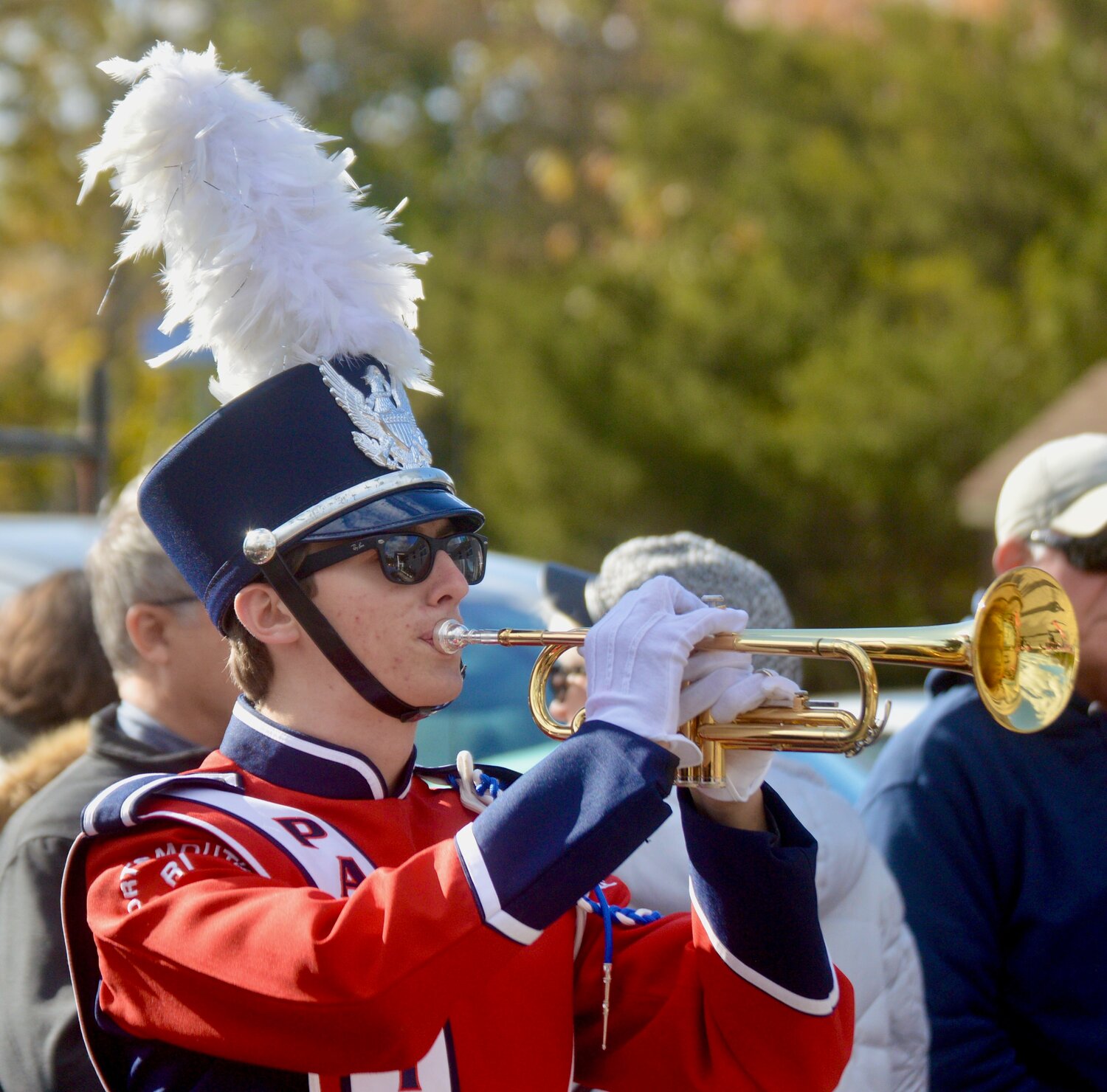 Henry Steadman of the Portsmouth High School band plays “Taps” outside the VFW.