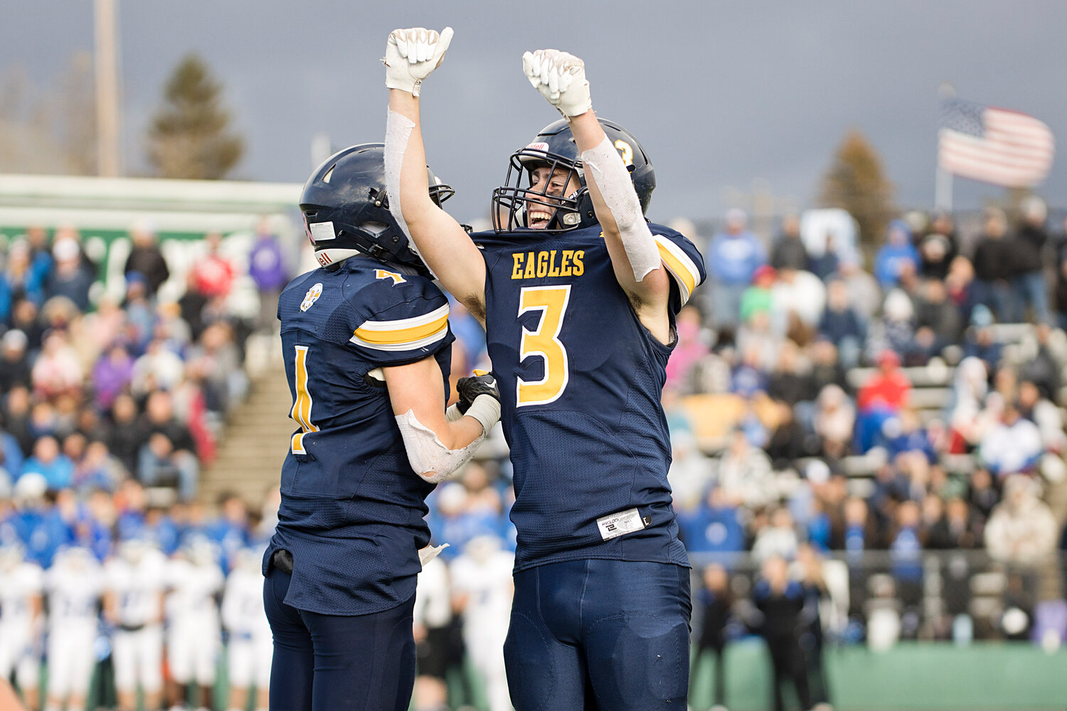 Jack Robinson (right) celebrates with Mitch Ivatts after catching a touchdown pass from Ivatts in the third quarter.
