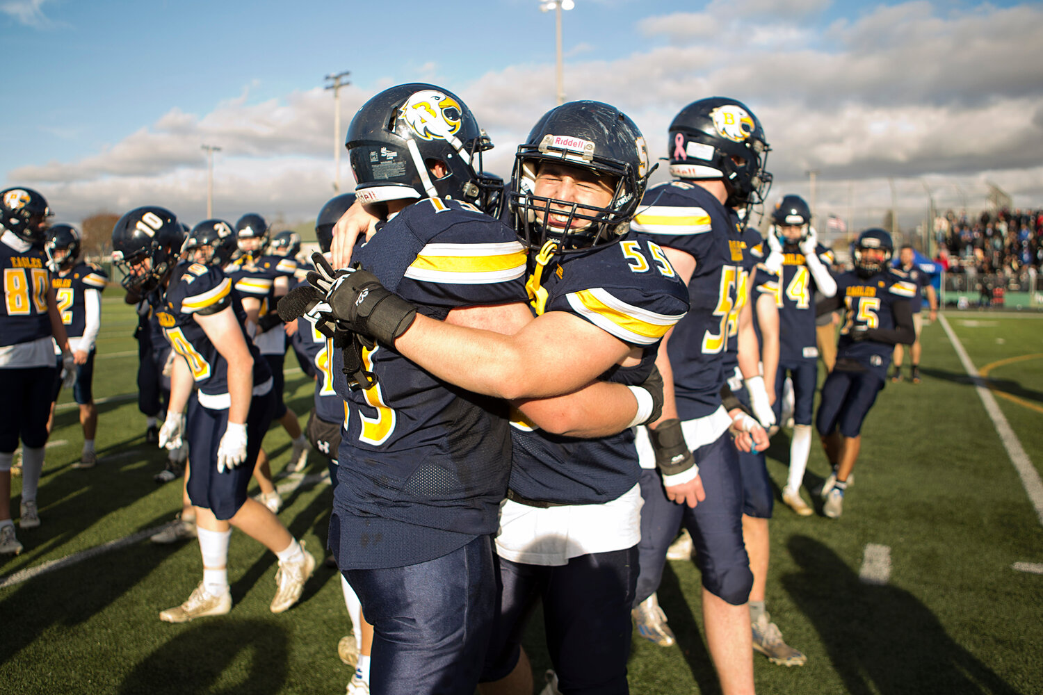 Joe Gonsalves (left) and Marco Lopergolo share a hug after the game.