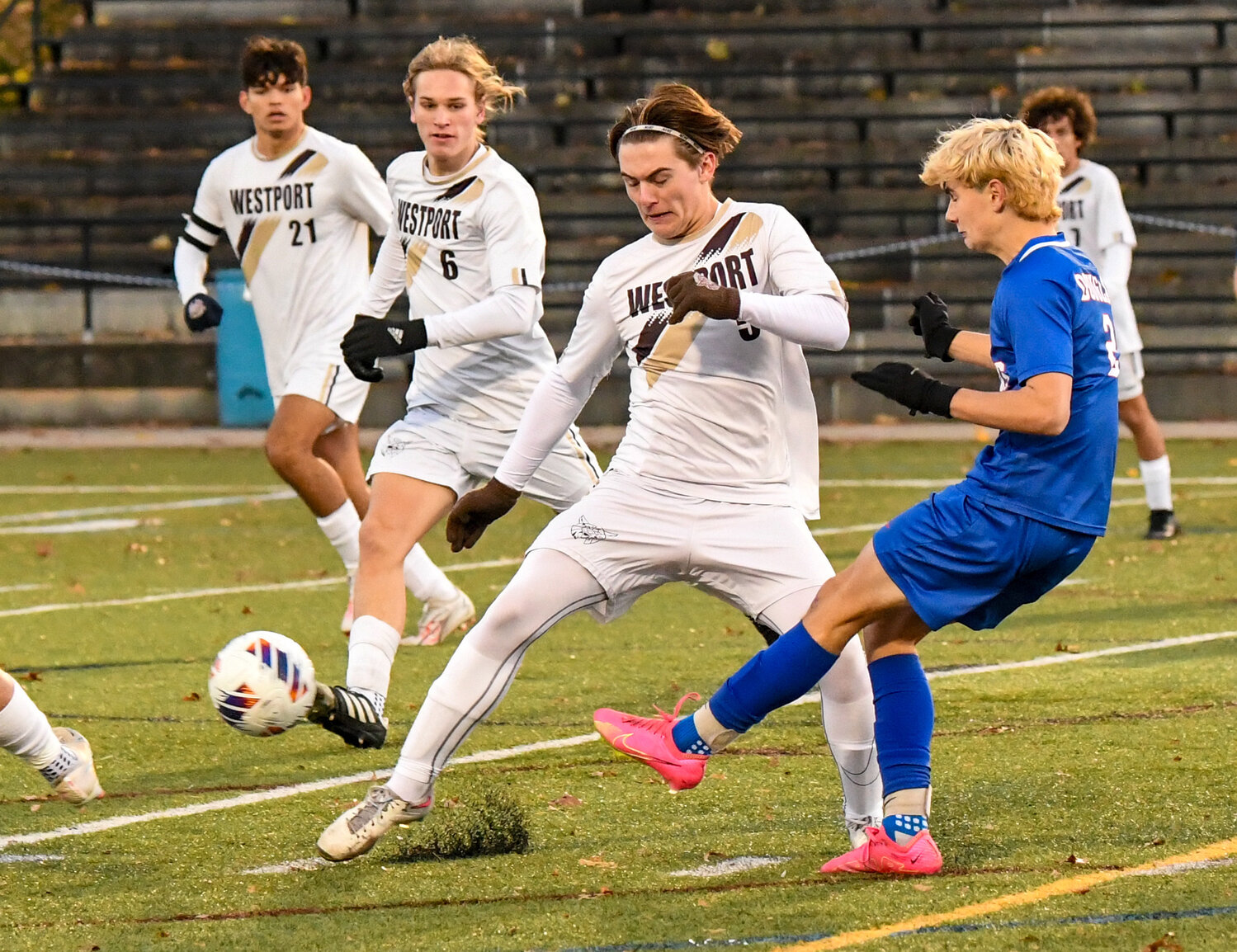 Wildcats Marcos Dutra Africano (left), Ryan Borges and Ben Cross defend an attack Saturday.