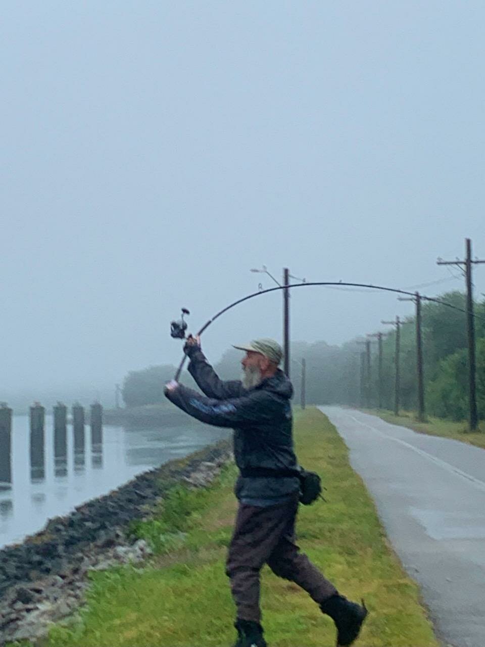 Bob “Bull” Mackinnon, loading up his rod for a Cape Cod Canal cast to stiped bass earlier this week. Photo submitted by Ed Doherty.