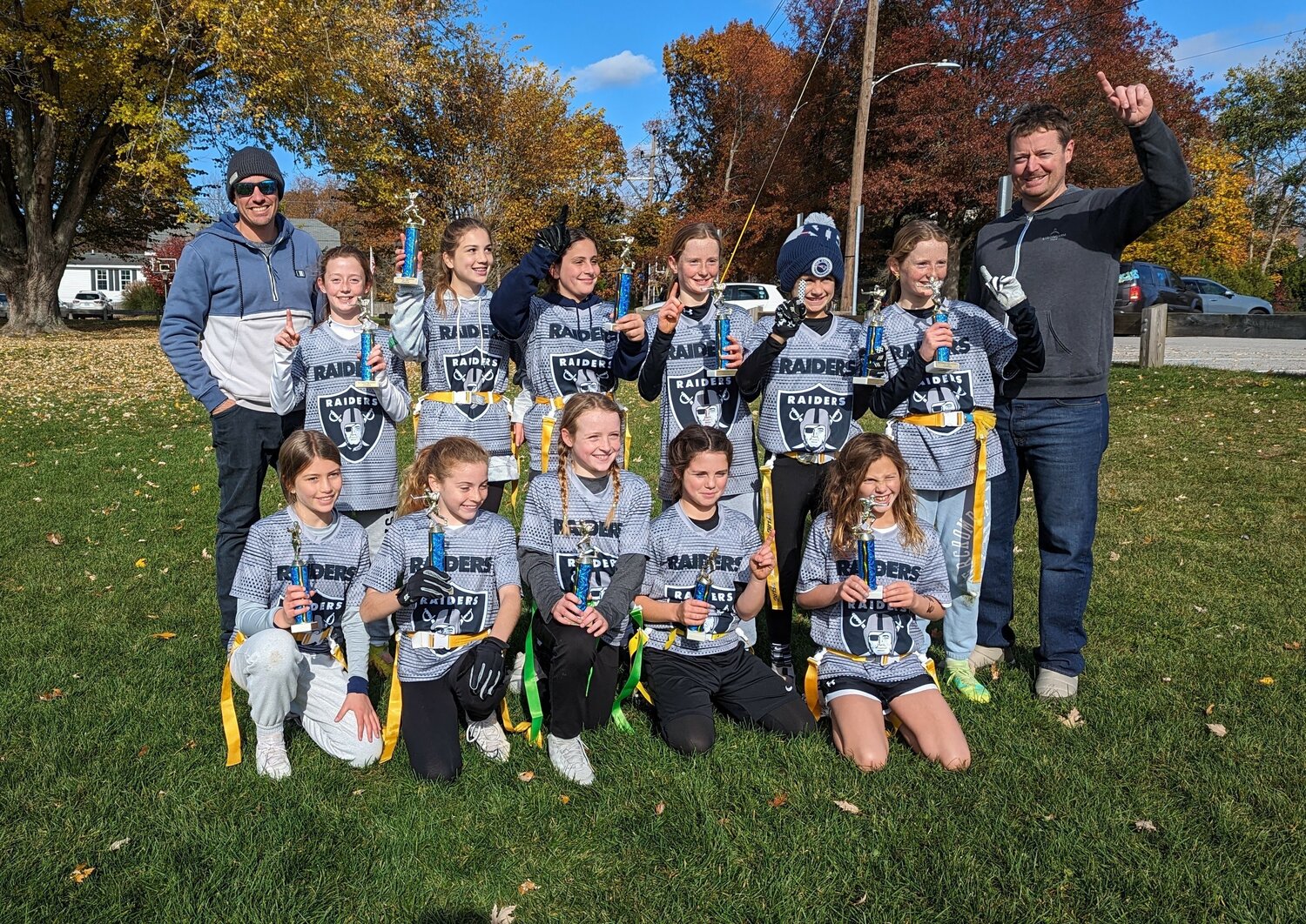 Members of the Raiders celebrated after winning the 10U Division Championship.